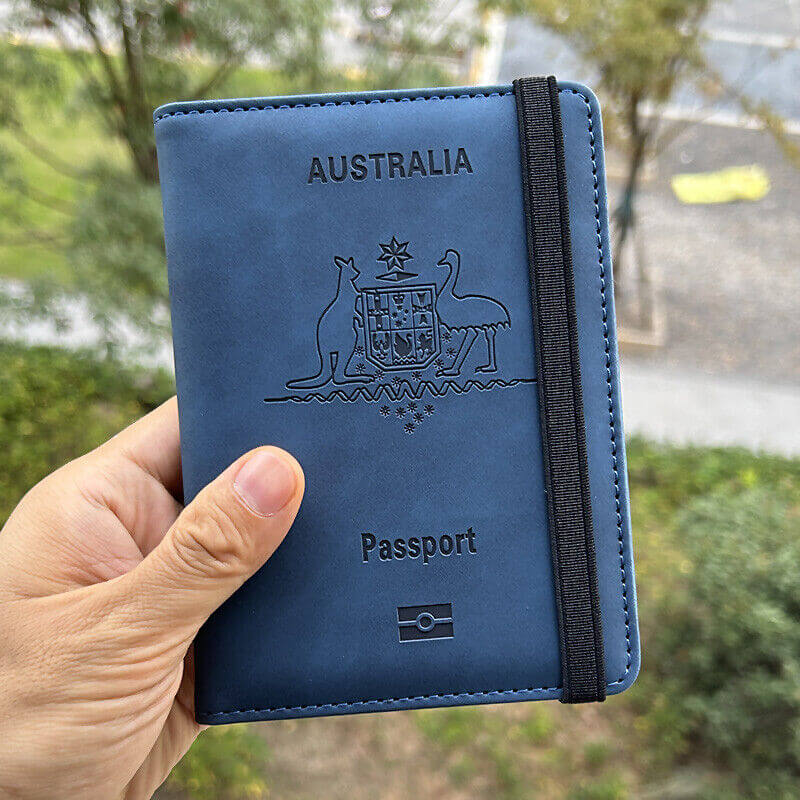 Hand holding Navy RFID Australia Passport Holder