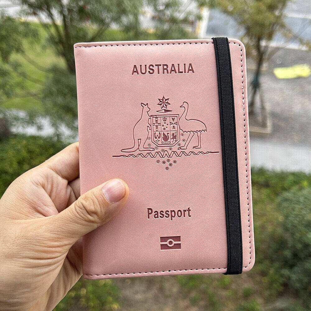Hand holding Pink RFID Australia Passport Holder
